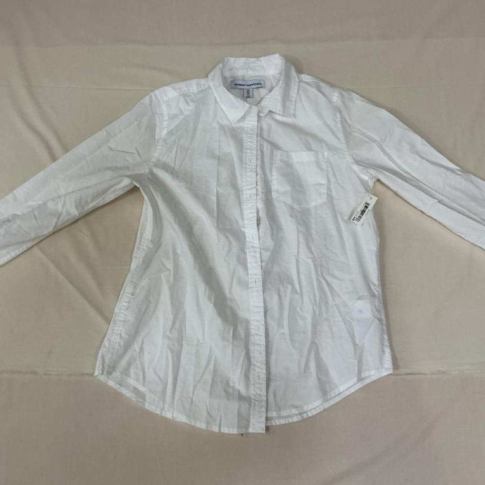 White button-up shirt by Amazon Essentials. Size Medium. Brand new with tags